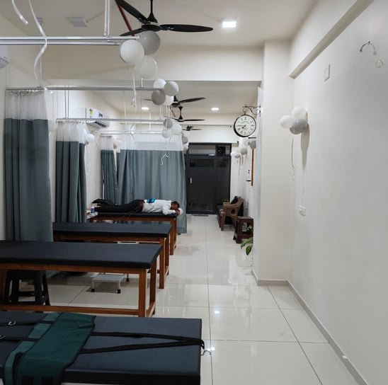 Inside the Physio Buddy physiotherapy clinic in Chandkheda, treatment beds and cubicles